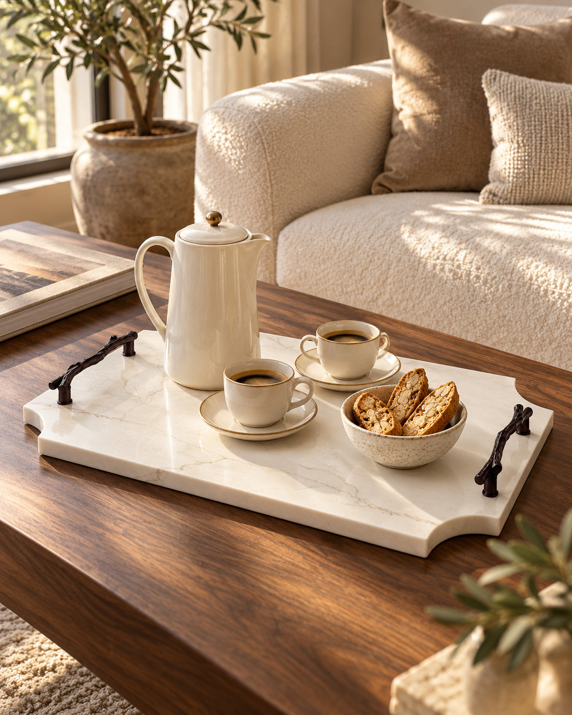 Maze Sicily stone tray with black branch handles, coffee and biscotti on a walnut table.